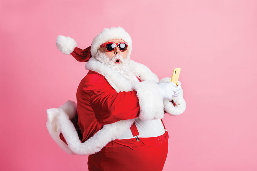 Santa Claus in front of a pink background