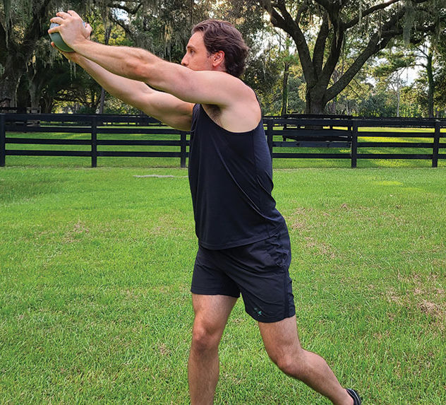 Personal trainer Mike Matthews performs the wood chopper exercise