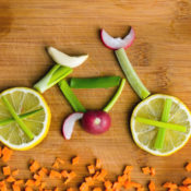 A bicycle made out of fruits and vegetables