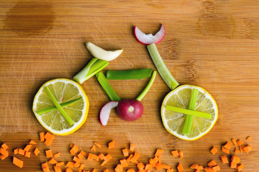 A bicycle made out of fruits and vegetables