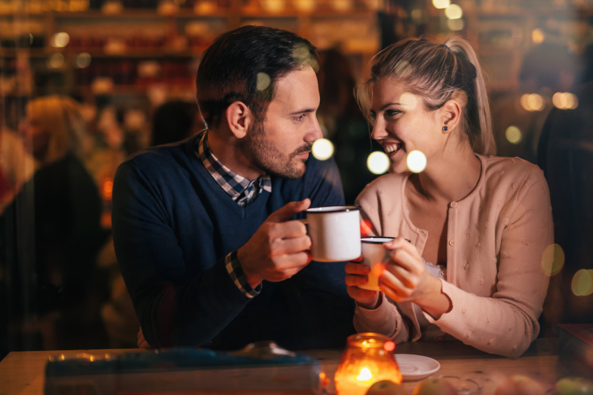 A couple dating in a pub