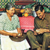 Soldier peels potatoes with his mother while on leave.