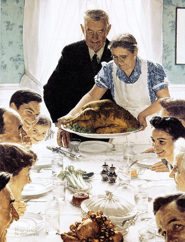 Large family enjoy a Thanksgiving meal