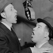 Bud Abbott and Lou Costello performing in a radio booth