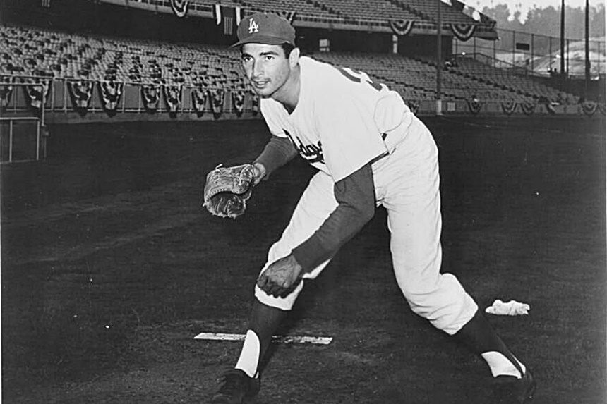Baseball Hall of Famer Sandy Koufax after throwing a pitch