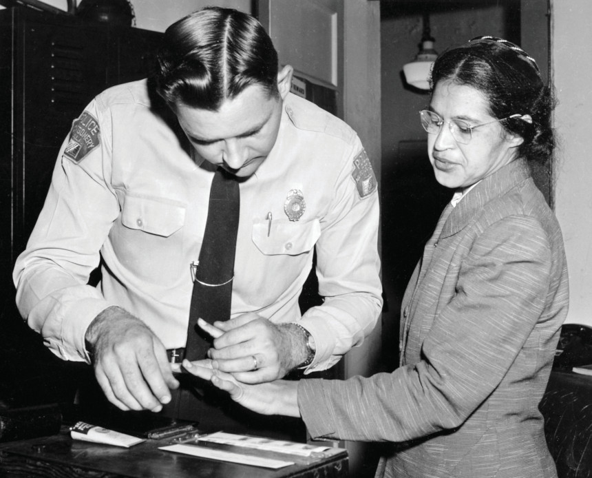 Civil rights activist Rosa Parks gets her fingerprints taken after being arrested.