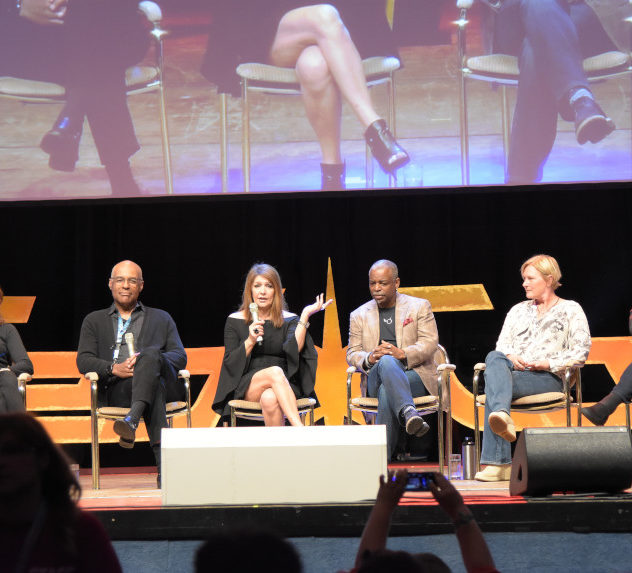 Cast members from Star Trek: The Next Generation at a convention panel.