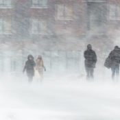 People in a city stuck in a blizzard