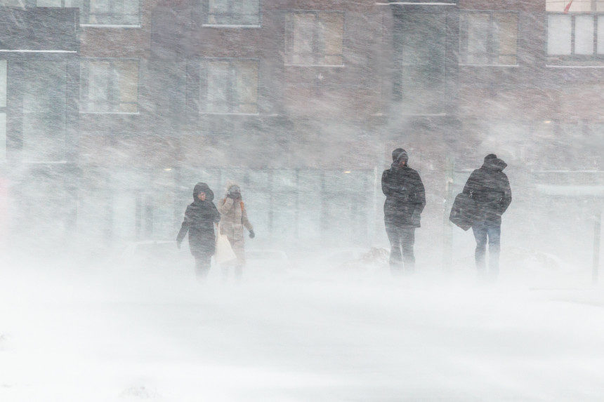 People in a city stuck in a blizzard