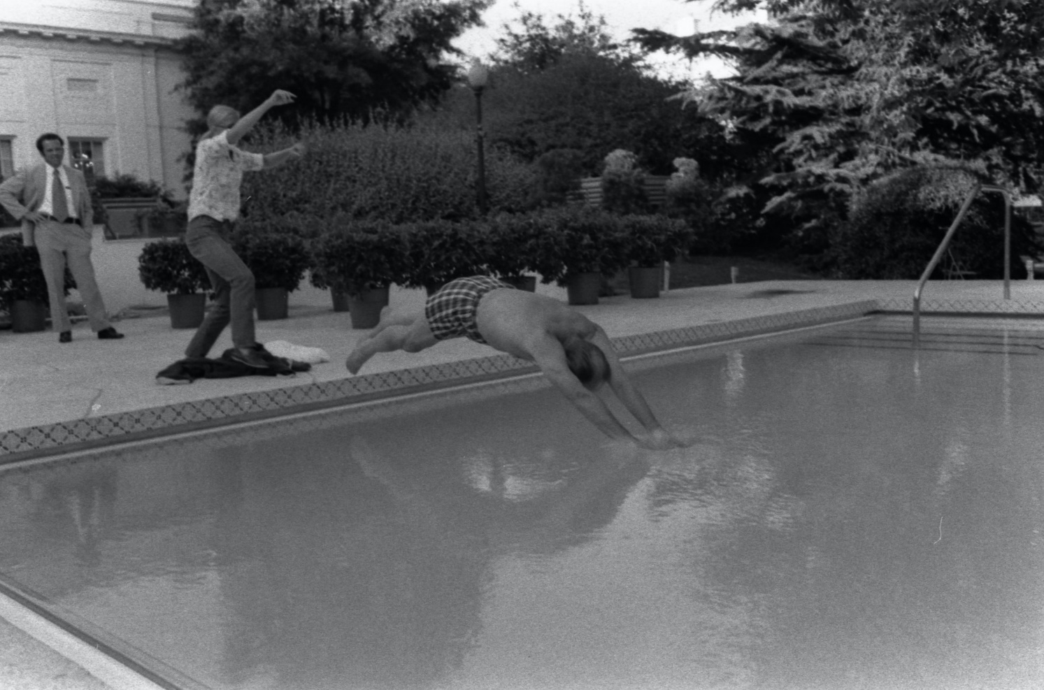 President Ford diving into the White House's swimming pool