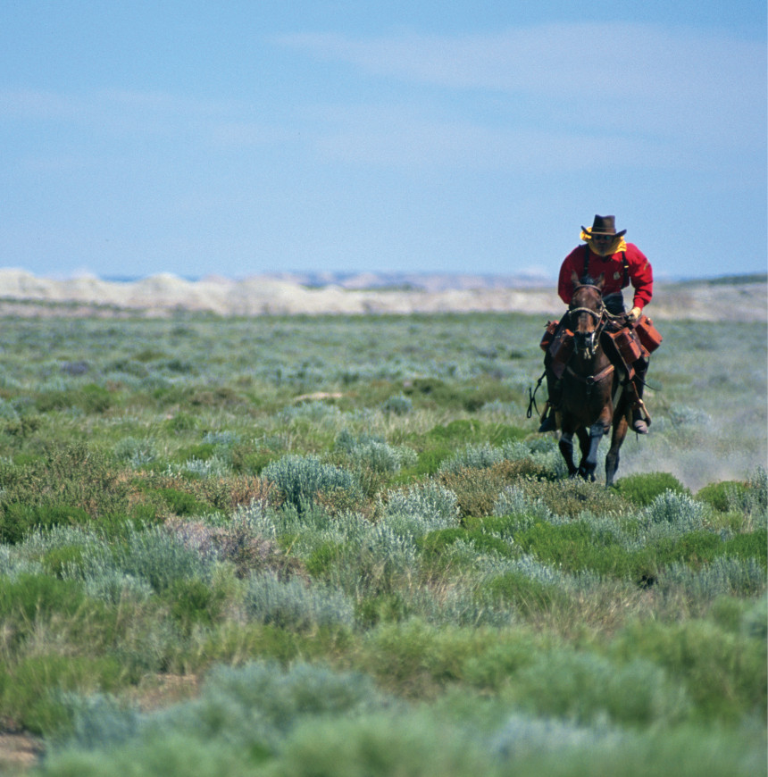 Pony Express rider on a horse in Wyoming.