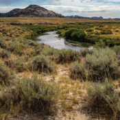 Sweetwater River in the Granite Mountains of Wyoming with sagebrush, sand, and flowing water