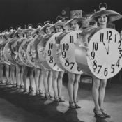 Women wearing clocks during a stage show