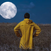 man looking at the moon