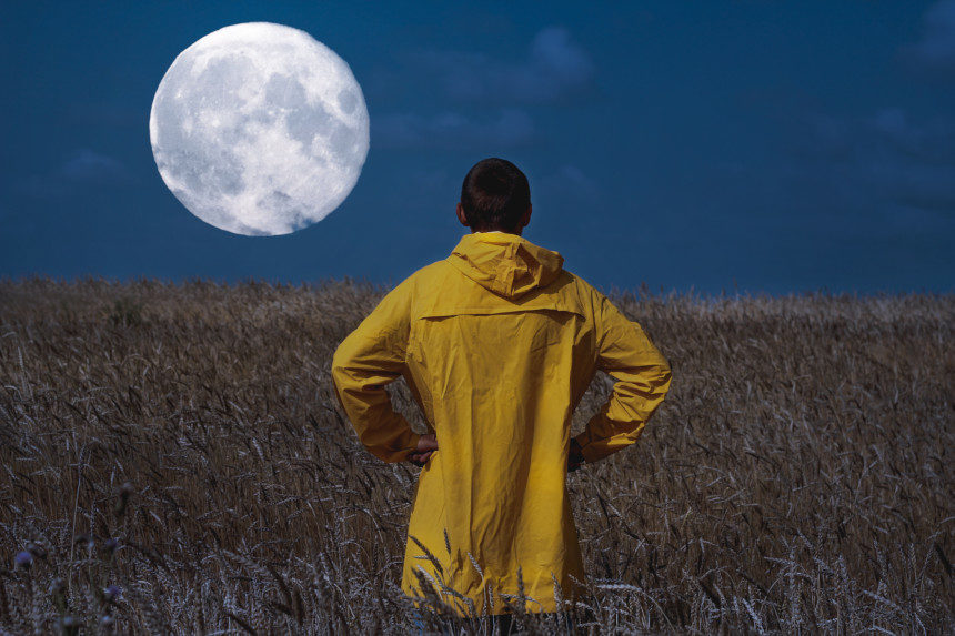 man looking at the moon