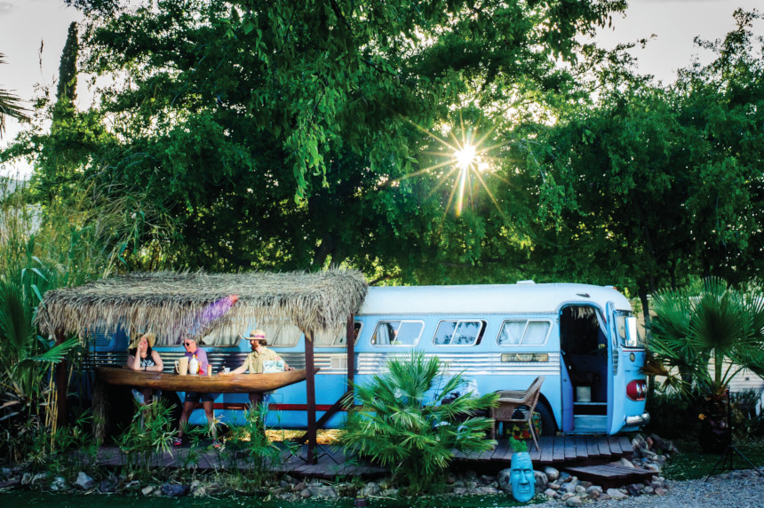 Patrons enjoying an evening outside a camper at the Shady Dell Vintage Trailer hotel in Bisbee, Arizona