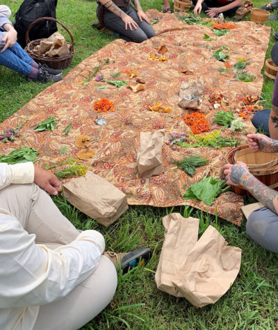 A group of foragers gather around the results of their labor.