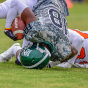 Football player being tackled