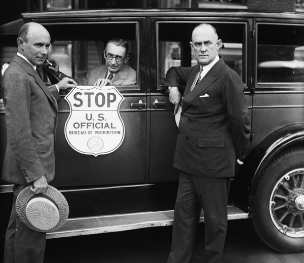 Prohibition agents standing in front of their crusier