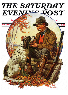 A hunter pets his dog on a break during a hunt.
