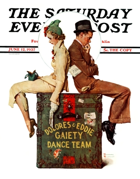 Vaudeville couple rests on trunk