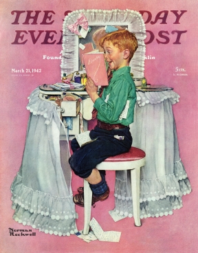 Boy seated at vanity table reading sisters diary