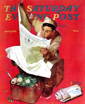 Soldier reading hometown news during kitchen duty