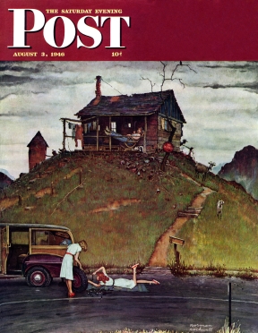 Two women change a flat, hillbilly watches from shack