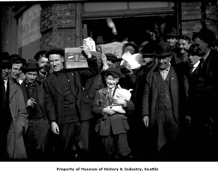 Men carrying groceries during a strike.