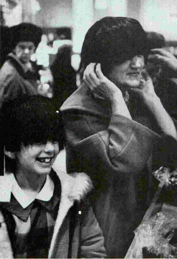 In New York store, mom and daughter don Beatle wigs. "Building the Beatle Image," The Saturday Evening Post. March 21, 1964.