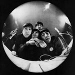 At Miami Beach press conference, John Lennon, Ringo Starr, Paul McCartney, George Harrison bug a fisheye camera.