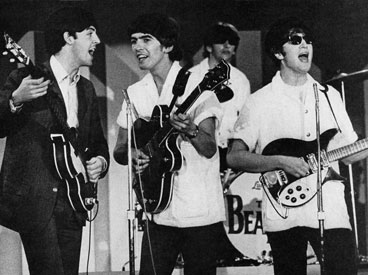 Paul, George, Ringo, and John rehearse for the Ed Sullivan show in Miami Beach. In Florida, the Beatles went yachting, swam in private pools, and visited heavyweight champ Cassius Clay. @SEPS 2013