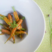 bowl of carrots with carrot top pesto