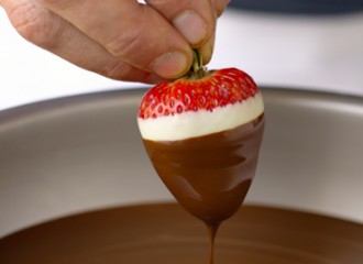 dipping strawberry in chocolate