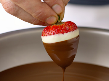 dipping strawberry in chocolate