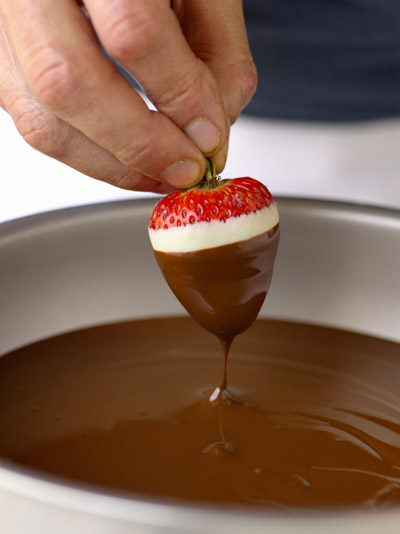 dipping strawberry in chocolate