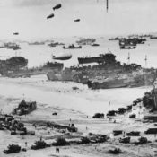 Landing craft, barrage balloons, and troops coming ashore at Normandy on D-Day, June 6, 1944. Source: Library of Congress