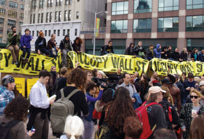 Populist uprising: Occupy Wall Street protesters made the “99 percent” slogan notorious. Protesters gathered at Zuccotti Park on Wall Street in November. Photo by David Shankbone.