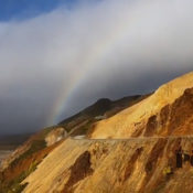 Rainbow over a mountain range.