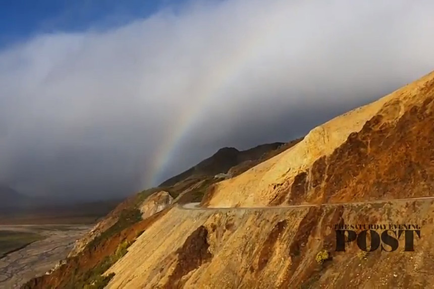 Rainbow over a mountain range.