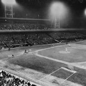 The Cincinnati Reds and Philadelphia Phillies play the first Major League Baseball game played at night.