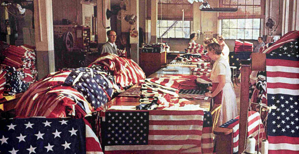 People Sewing 50 Stars on US Flag