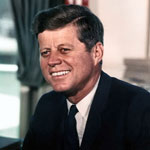 Official White House photo of President Kennedy in the Oval Office.