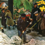 mand shoveling floral shop sidewalk