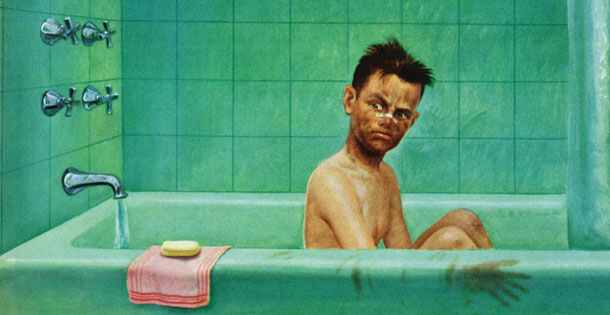 Dirty boy football player in bathtub