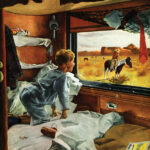 A boy in pajamas looks out the window of his sleeper train car and sees a real-life cowboy on a horse in front of a western butte.
