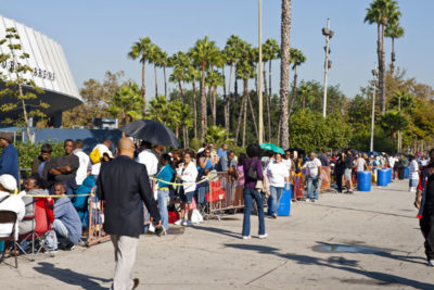 People without medical insurance wait in long lines around the block to see doctors at a free medical clinic at the Sports Arena in Los Angeles in 2011.
