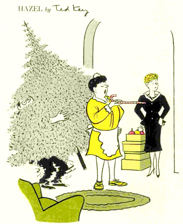 A housekeeper, with a large candy cane, directs a Christmas tree delivery man to where she would him to place the large pine. The delivery man is struggling under the tree's weight.