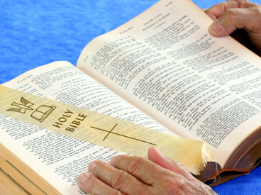 Person reading The Bible
