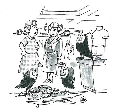 Two department store clerks look on as a wake of buzzards pick through clothes that have been knocked off a rack.